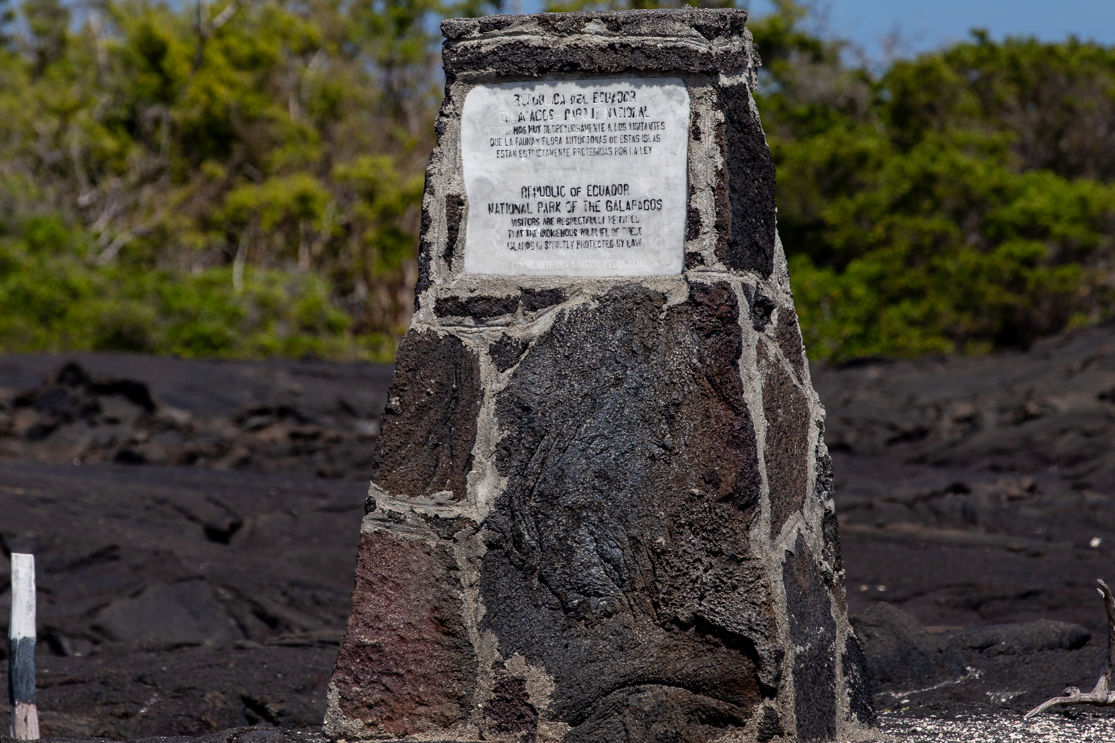Stone marker with a plaque for the Republic of Ecuador National Park of the Galapagos